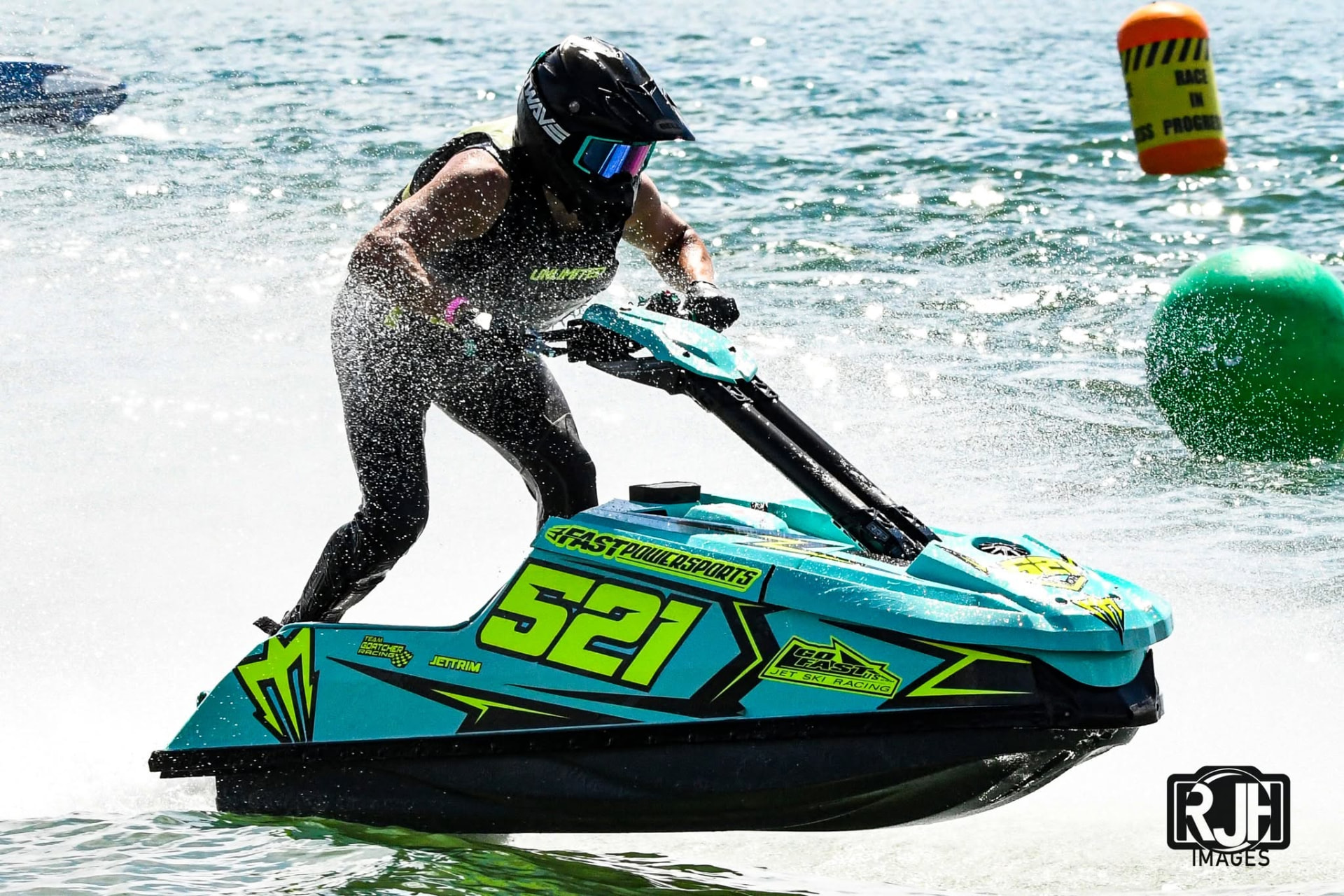 Team Goatcher Racing number 327 jet ski carving a buoy turn